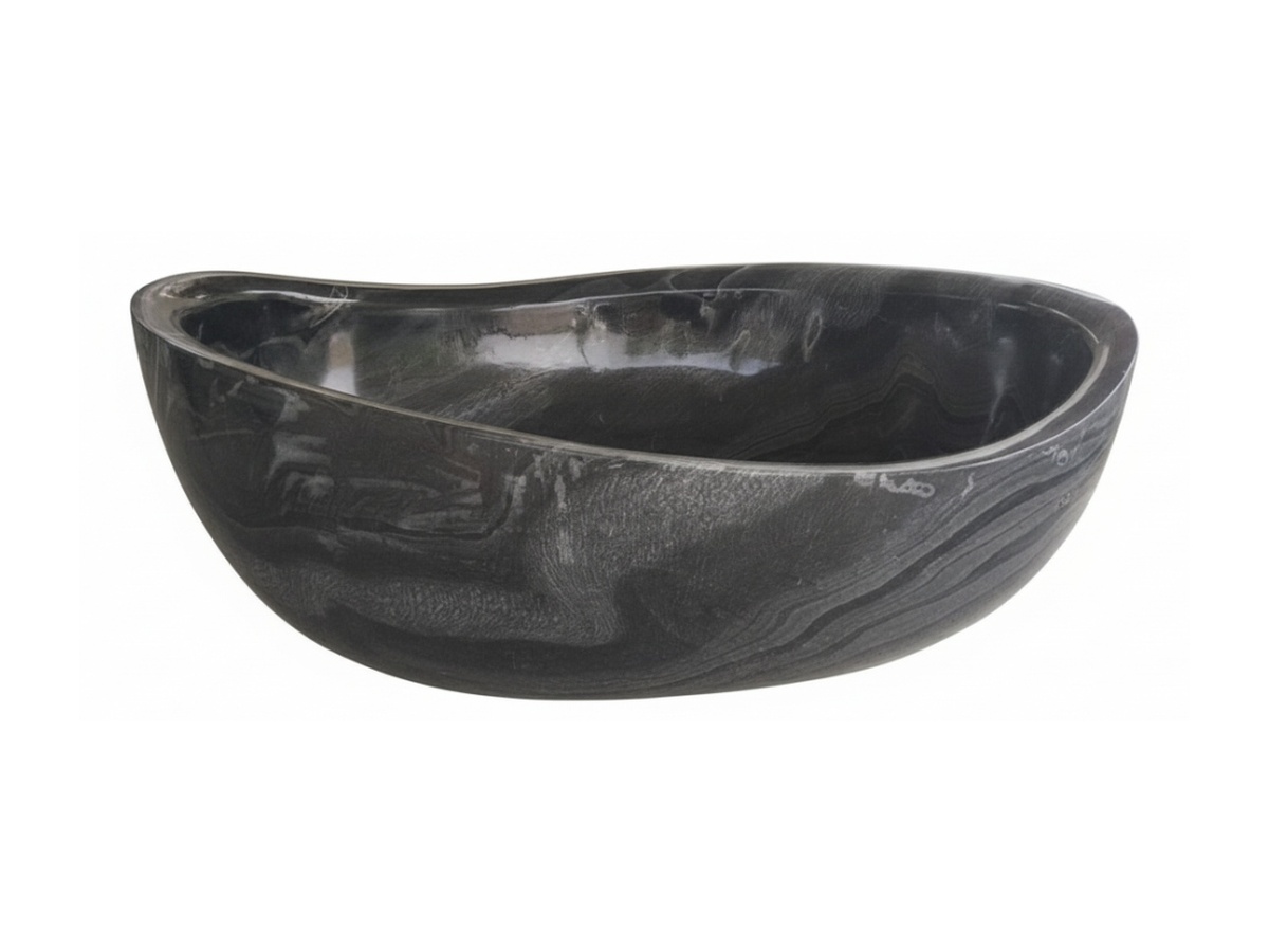 Hand-carved dark natural stone bathtub example